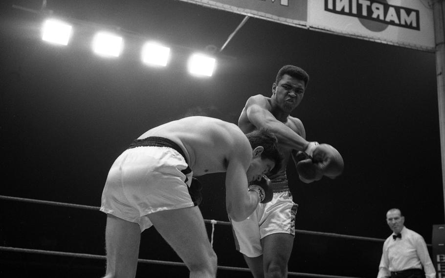 Muhammad Ali takes on German boxer Karl Mildenberger in the ring at the Waldstadion in Frankfurt, Germany, on Sept. 10, 1966. 