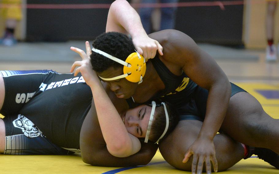 Vicenza’s Daniel Bagoudou pressures Leif Myer of Hohenfels in a 215-pound match on opening day at the DODEA-Europe wrestling finals in Wiesbaden, Germany, Feb. 10, 2023. Bagoudou won the first-round match.