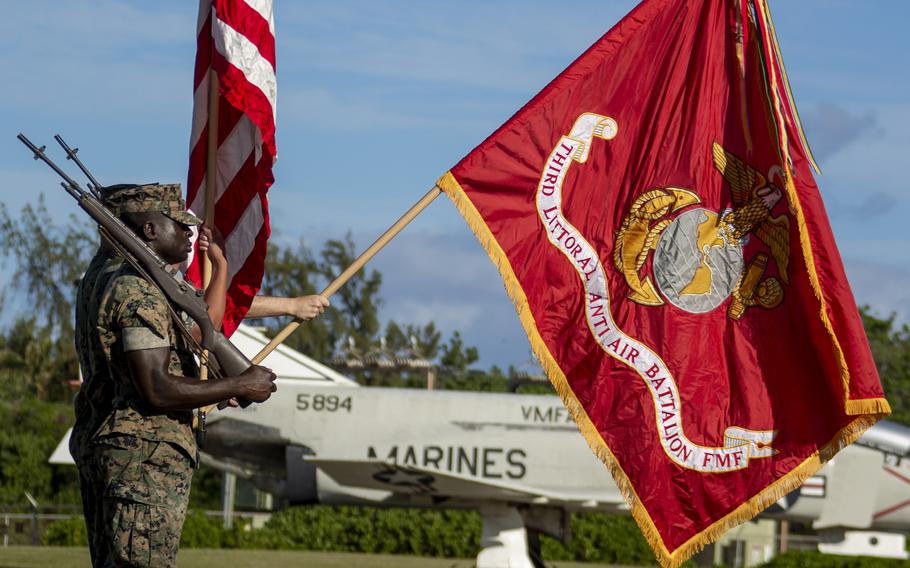 Marines with 3rd Littoral Anti-Air Battalion, 3rd Marines, 3d Marine Division, present the battalion colors during an activation ceremony at Marine Corps Base Hawaii, Feb. 11, 2022. 