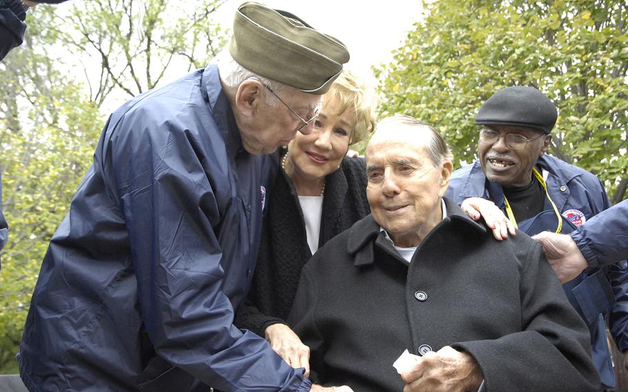 Former Sen. Bob Dole, R-Kan., visits with veterans at the World War II Memorial in Washington, D.C., in 2012. 