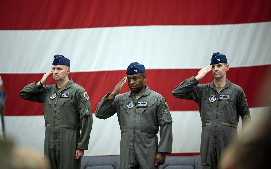 Brig. Gen. Ryan Keeney, 7th Air Force's deputy commander; Col. Henry Jeffress, III, outgoing 8th Fighter Wing commander; and Col. Timothy Murphy, the incoming commander, salute during a change-of-command ceremony at Kunsan Air Base, South Korea, Thursday, May 25, 2023.