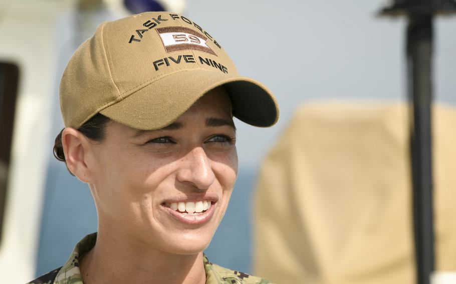 Lt. j.g. Sofia Gross, chief strategy officer of Task Force 59, explains how the organization uses aquatic and aerial drones on Nov. 30, 2022, while aboard the USCGC Emlen Tunnell, a Coast Guard cutter deployed to the Persian Gulf. The Navy created Task Force 59 in 2021 to integrate unmanned systems on the surface, underwater and in the air.