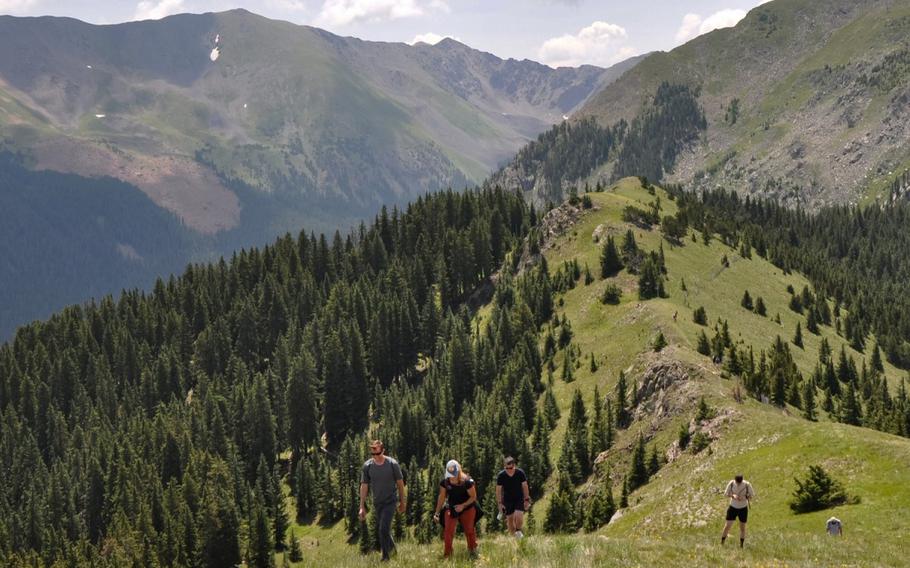 U.S. Army Research Institute of Environmental Medicine scientists, University of New Mexico emergency care providers, and 5th Engineer Battalion Soldiers return from a hike to Kachina Peak in Taos Ski Valley, N.M. The study is the first ever conducted on Kachina Peak, and, with 41 study volunteers, it is the largest altitude study in USARIEMs history. 