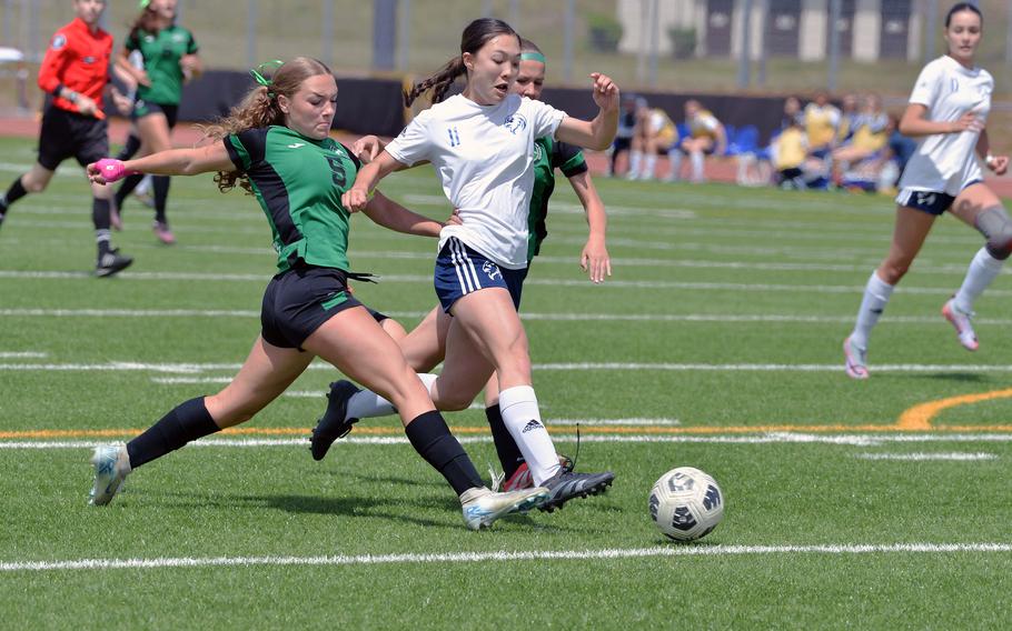 Black Forest Academy’s Olivia Wilson gets between Naples’ Emma Heavey and Sonja Gottlieb in the girls Division II final at the DODEA-Europe soccer championships in Ramstein, Germany, May 22, 2025. Naples won the game 2-0.