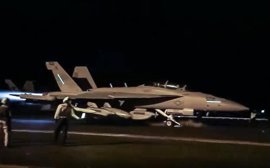 A video screen grab shows an F/A-18 Super Hornet taking off from the aircraft carrier USS Dwight D. Eisenhower on Jan. 11, 2024, to target Houthi militant sites in Yemen.