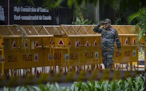 An Indian paramilitary soldier stands guard next to a police barricade outside the Canadian High Commission in New Delhi, India, Tuesday, Sept. 19, 2023. Tensions between India and Canada are high after Prime Minister Justin Trudeau's government expelled a top Indian diplomat and accused India of having links to the assassination in Canada of Sikh leader Hardeep Singh Nijjar, a strong supporter of an independent Sikh homeland. (AP Photo/Altaf Qadri)