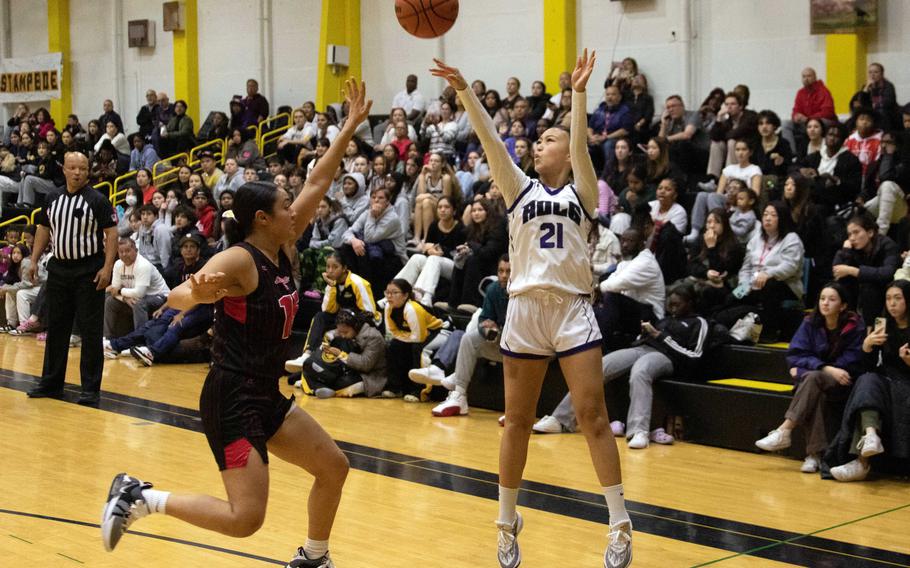 Academy of Our Lady's Kaeden Canovas shoots over Nile C. Kinnick's Leona Turner. The Cougars won the ASIJ Kanto Classic girls final 27-19.