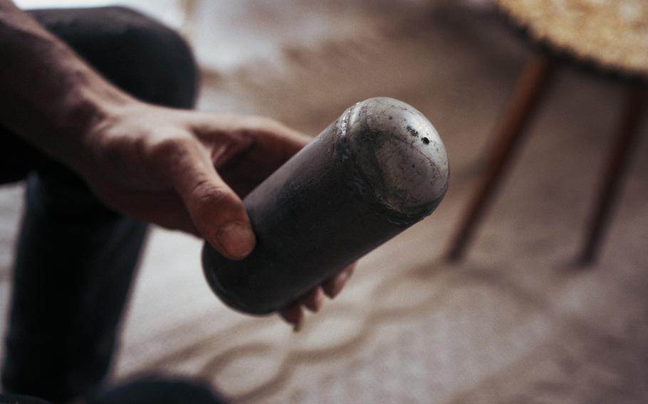A militant from Islamic Jihad holds a homemade bomb in the Jenin refugee camp in the West Bank on Nov. 1, 2023.