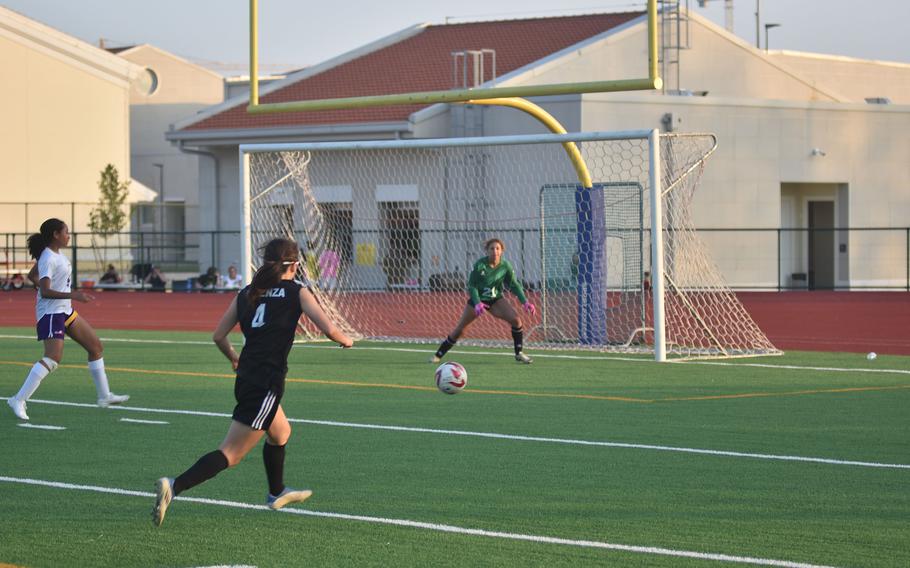 Vicenza’s Julia Rudy watches her shot on goal head toward Bahrain keeper Jayda Miller on Friday, April 12, 2024 in the Cougars’ 1-0 victory.