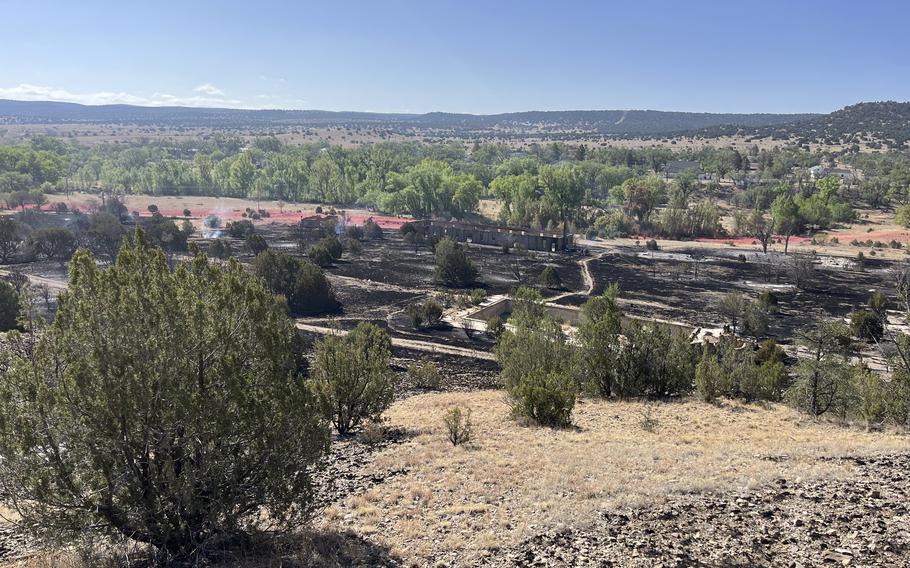 A large swath of burned land in a desert area.