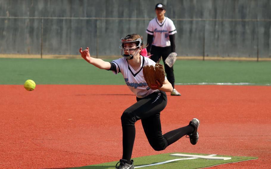 Isabelle McKibban pitches.