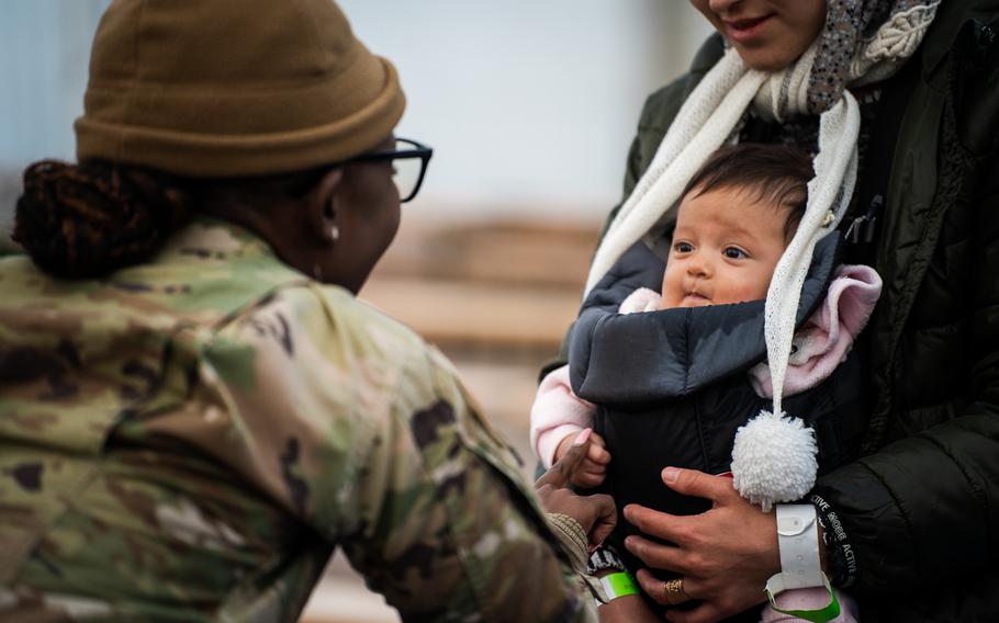 U.S Air Force Staff Sgt. Tessie Odhiambo, Personnel Support for Contingency Operations’ noncommissioned officer in charge of personal support, helps evacuees prepare for a flight to the United States from Ramstein Air Base, Germany, Saturday, Oct. 9, 2021. 