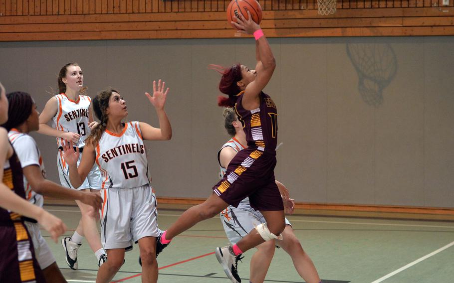 Baumholder’s Jezania Gibson gets through the Spangdahlem defense on her way to the basket in a Division III game at the DODEA-Europe basketball championships in Baumholder, Germany, Feb. 16, 2023.