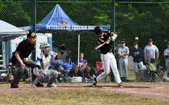Stuttgart Panthers’ #9 Caiden Ray hits his second double against the Wiesbaden Warriors' pitcher in the team’s opening game of the tournament at the 2022 DoDEA-Europe Baseball Championship.