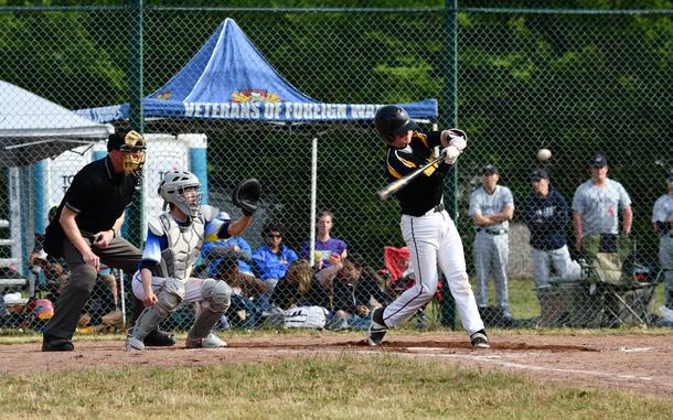 Stuttgart Panthers’ #9 Caiden Ray hits his second double against the Wiesbaden Warriors' pitcher in the team’s opening game of the tournament at the 2022 DoDEA-Europe Baseball Championship.