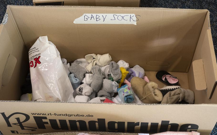 Donations for Afghan refugees are sorted by category at a supply drive at Ramstein Air Base on Aug. 26, 2021.