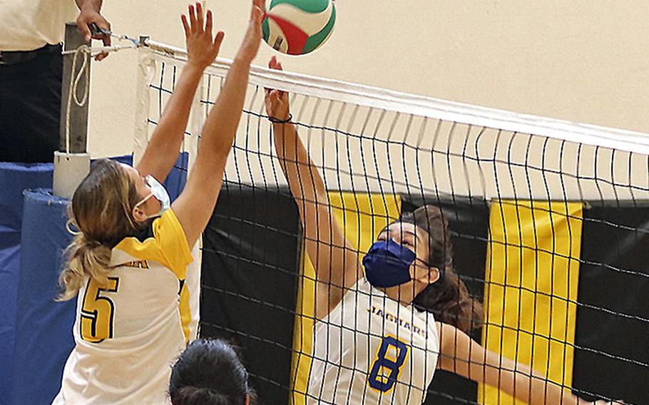 Marley Mcelree of Sigonella tries to get the ball over Vicenza's Shalom Dejardin during a September match at Vicenza. There is a full slate of girls volleyball action this weekend. 