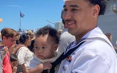 Petty Officer 2nd Class Dimitri Rivera holds son Omari for the first time as the USS Gravely returned from deployment on June 24, 2022.
