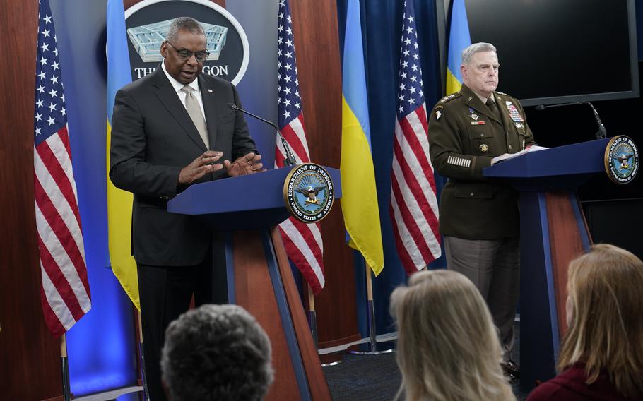 Defense Secretary Lloyd Austin, left, speaks during a briefing with Army Gen. Mark Milley, chairman of the Joint Chiefs of Staff, right, at the Pentagon on Wednesday, Nov. 16, 2022. 