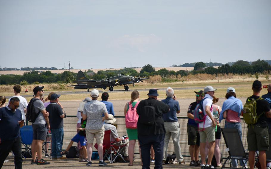 Visitors watch and take pictures as the B-17, also known as the Sally B, moves into position to prepare for takeoff at the Duxford Air Show. 