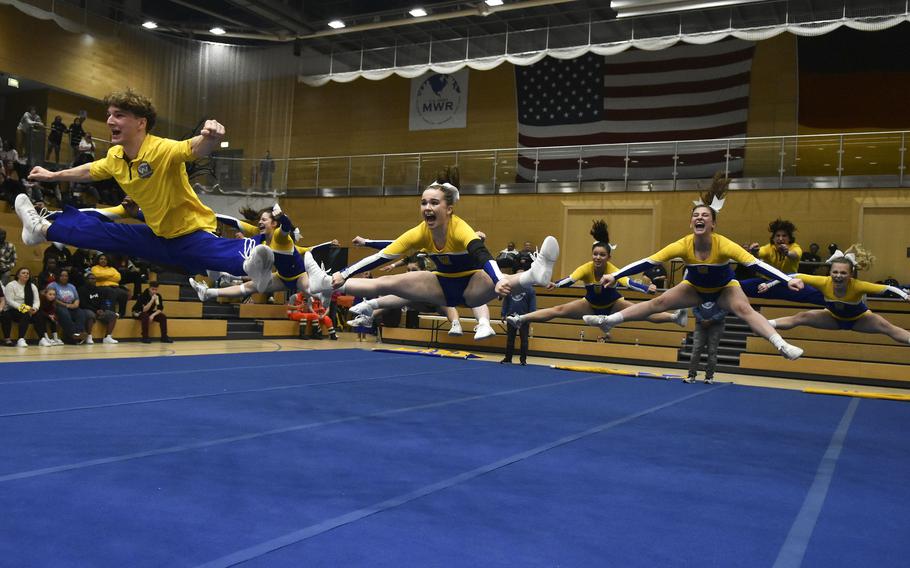 Jack Hatch leads a jump with the Wiesbaden cheer team during the 2024 DODEA-Europe Cheerleading Championships in Wiesbaden, Germany on Friday, Feb. 16, 2024. Wiesbaden won the DODEA-Europe Division I Cheerleading Championship for the third consecutive year. 