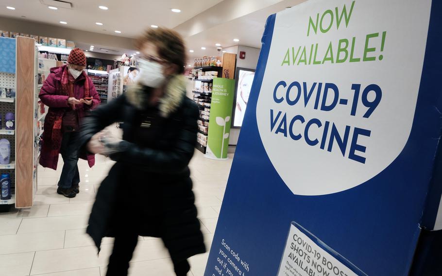 A pharmacy in Grand Central Terminal advertises the COVID-19 vaccine on Thursday, Dec. 9, 2021 in New York City. Health officials are urging Americans to get vaccinated and receive their booster shots to help protect themselves and others against the omicron variant, that continues to spread rapidly into 2022.  