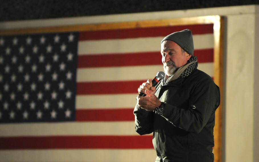 Actor and comedian Robin Williams performs his act for service members during the annual USO Holiday Tour on Bagram Airfield in December 2010.