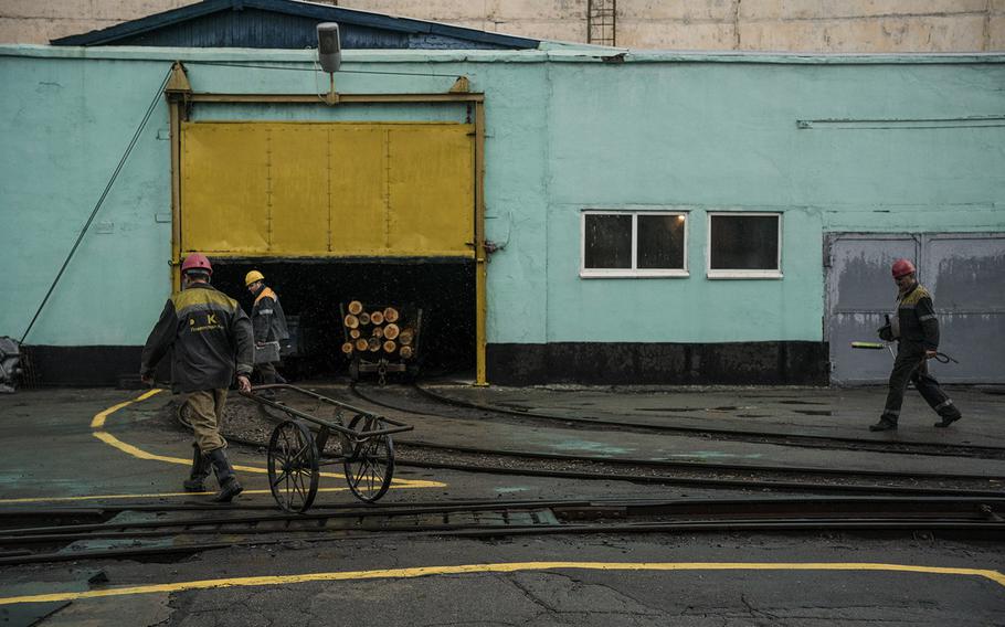 Russian missiles have hit communities not far from the coalfields of the eastern Donbas region, but miners continue their work. 