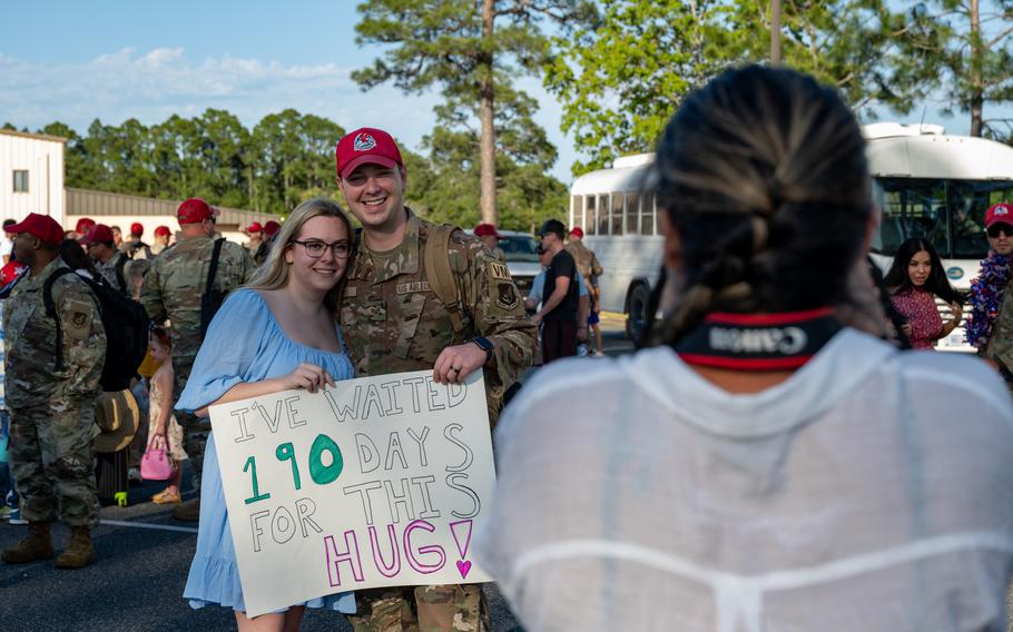 A U.S. Air Force airman assigned to the 823rd Rapid Engineer Deployable Heavy Operational Repair Squadron Engineer poses for a photo with his family at Hurlburt Field, Fla., Sunday, April 14, 2024. 