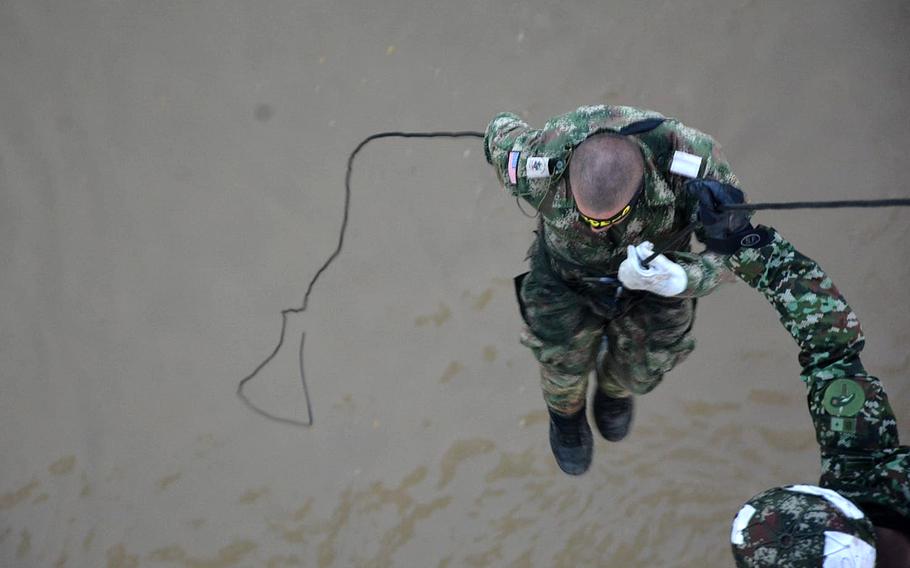U.S. Army Sgt. Angel Partidas of the 173rd Airborne Brigade rappels down a rope in October 2023 during the 73-day Lancero course in Tolemaida, Colombia.