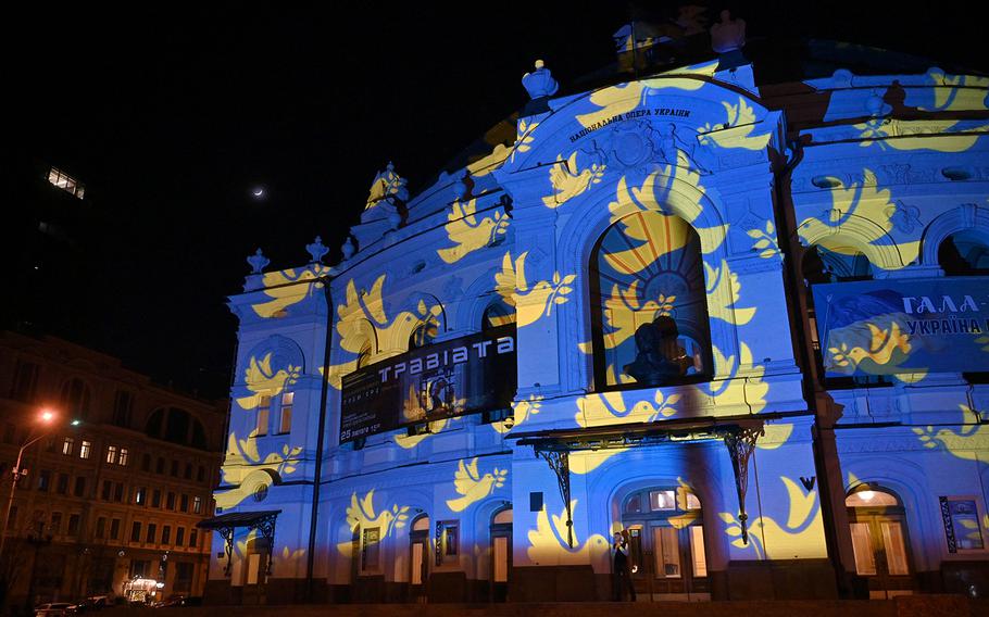 A light installation by Swiss artist Gerry Hofstetter is projected on the main Post Office building in Kyiv on Feb. 23, 2023, on the eve of first anniversary of the Russian invasion to Ukraine. 