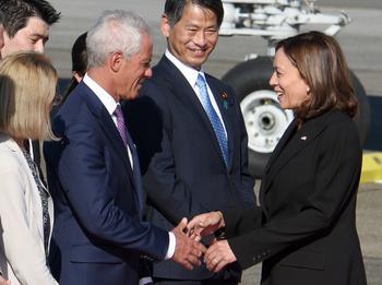 Vice President Kamala Harris greets U.S. Ambassador to Japan Rahm Emanuel upon her arrival at Yokota Air Base, Japan, Monday, Sept. 26, 2022. 