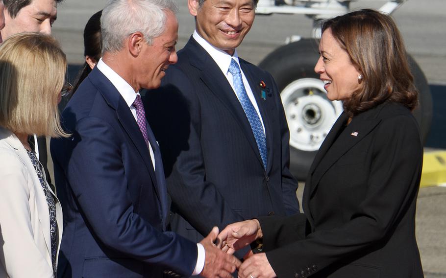 Vice President Kamala Harris greets U.S. Ambassador to Japan Rahm Emanuel upon his arrival at Yokota Air Base, Japan, Monday, Sept. 26, 2022.