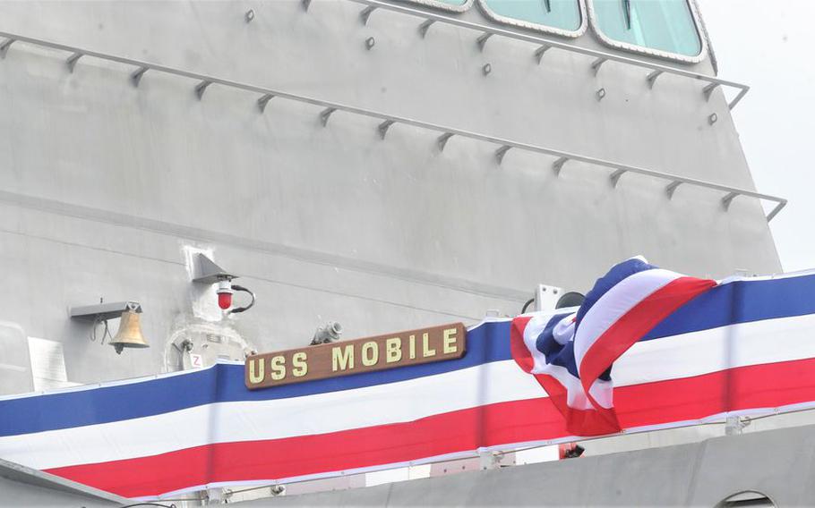 A plaque displays the name that LCS-26 will formally assume at its commissioning ceremony on May 22, 2021.
