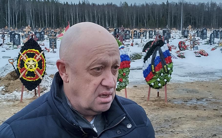 Wagner Group head Yevgeny Prigozhin attends the funeral of Dmitry Menshikov, a fighter of the Wagner group who died during a special operation in Ukraine, at the Beloostrovskoye cemetery outside St. Petersburg, Russia, Saturday, Dec. 24, 2022. The fighting for Soledar and Bakhmut again highlighted a bitter rift between the top military brass and Yevgeny Prigozhin, a rogue millionaire whose Wagner Group military contractor has played an increasing role in Ukraine.