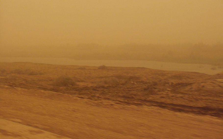A blurry and orange-tinted image of a desert.