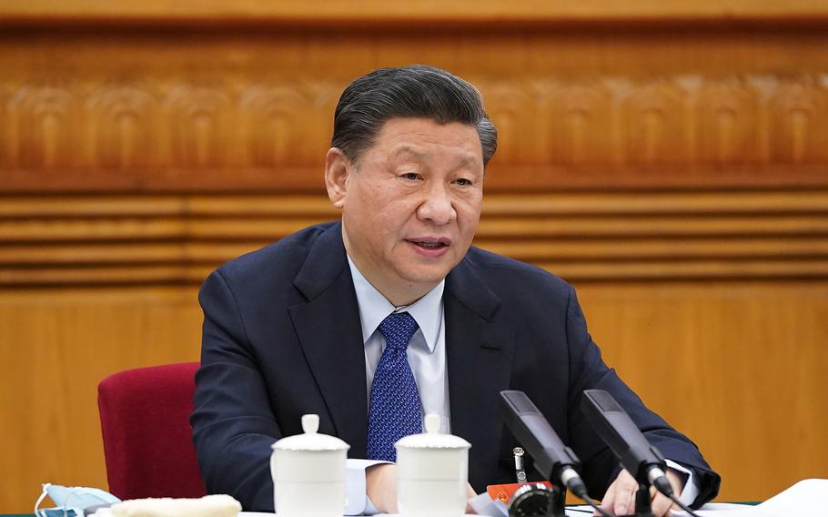 Chinese President Xi Jinping, also general secretary of the Communist Party of China Central Committee and chairman of the Central Military Commission, takes part in a deliberation with lawmakers from Qinghai Province, at the fourth session of the 13th National People’s Congress in Beijing on March 7, 2021.