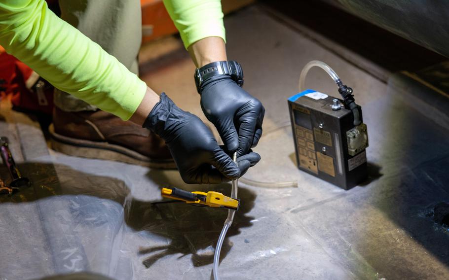 A Navy contractor prepares a tube for soil vapor monitoring at the Red Hill Bulk Fuel Storage Facility in Hawaii on March 25, 2024.