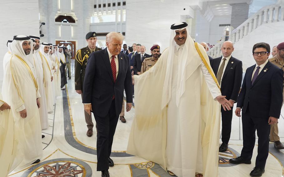 Qatar’s Emir Sheikh Tamim bin Hamad Al Thani welcomes President Donald Trump.