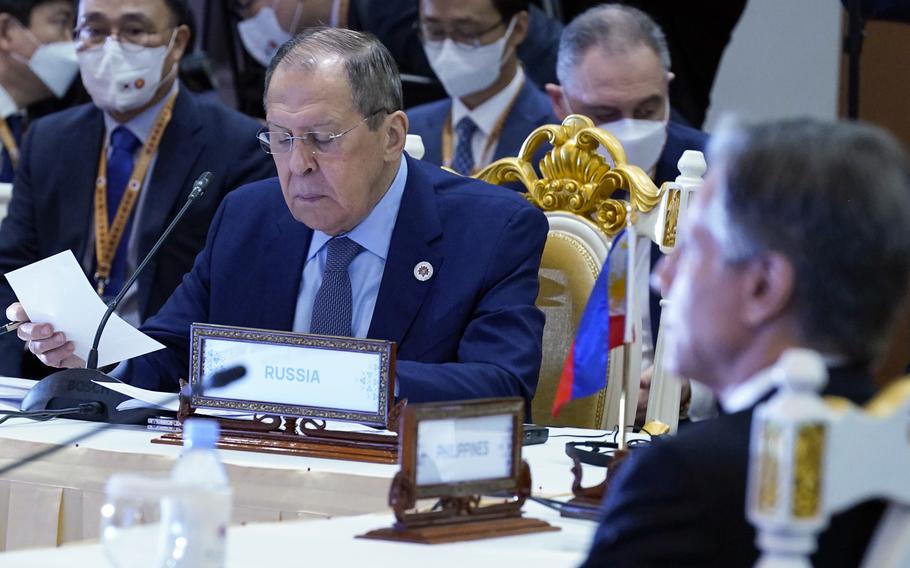 Secretary of State Antony Blinken, center right, and Russian Foreign Minister Sergey Lavrov, center left, are seated close together during an east Asia summit foreign ministers meeting at Sokha Hotel in Phnom Penh, Cambodia, Friday, Aug. 5, 2022. 