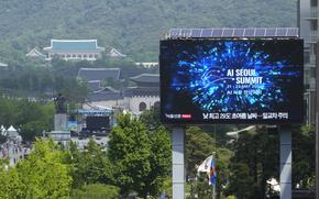 A screen shows an announcement of the AI Seoul Summit in Seoul, South Korea, Tuesday, May 21, 2024. World leaders are expected to adopt a new agreement on artificial intelligence when they gather virtually Tuesday to discuss AI’s potential risks but also ways to promote its benefits and innovation.