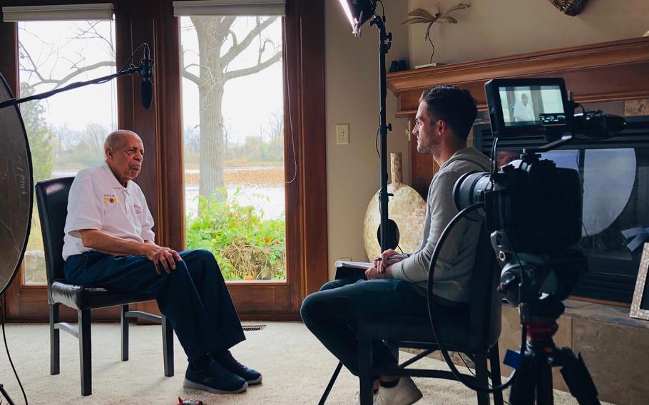 Harold Brown of Port Clinton, Ohio, is a former Tuskegee Airman, who flew 30 missions. He is being interviewed by filmmaker Joshua Scott in his home.