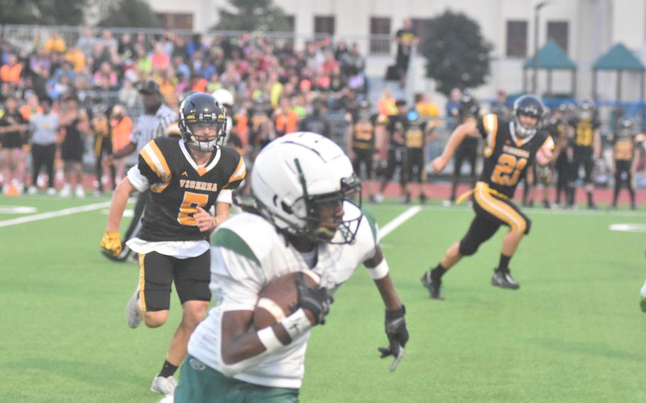 Naples' Jeramiah Robinson scampers away from the Vicenza defense for a big gain Friday, Sept. 22, 2023, in the Wildcats' 40-0 victory in Vicenza, Italy.