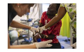 Marc Baptiste is treated for a bullet wound at a Doctors Without Borders emergency room in the Cite Soleil neighborhood of Port-au-Prince, Haiti, on April 19, 2024. 