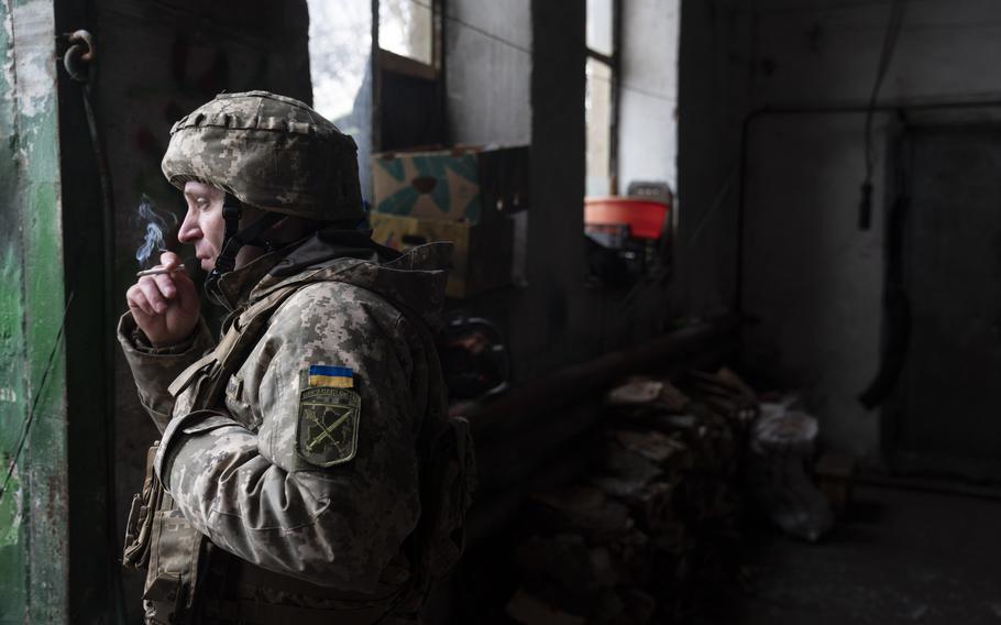 A Ukrainian soldier takes shelter from Russian-backed separatist positions that had shelled the area in Novoluhanske in the Donetsk region of eastern Ukraine. Attacks along the border of Kyiv-controlled Ukraine and the separatist regions have increased sharply. 