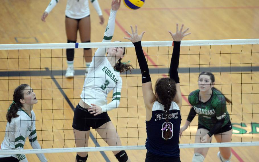 Kubasaki's Adria Lockhart sends one over the net against Seisen's Lisa Purcell.