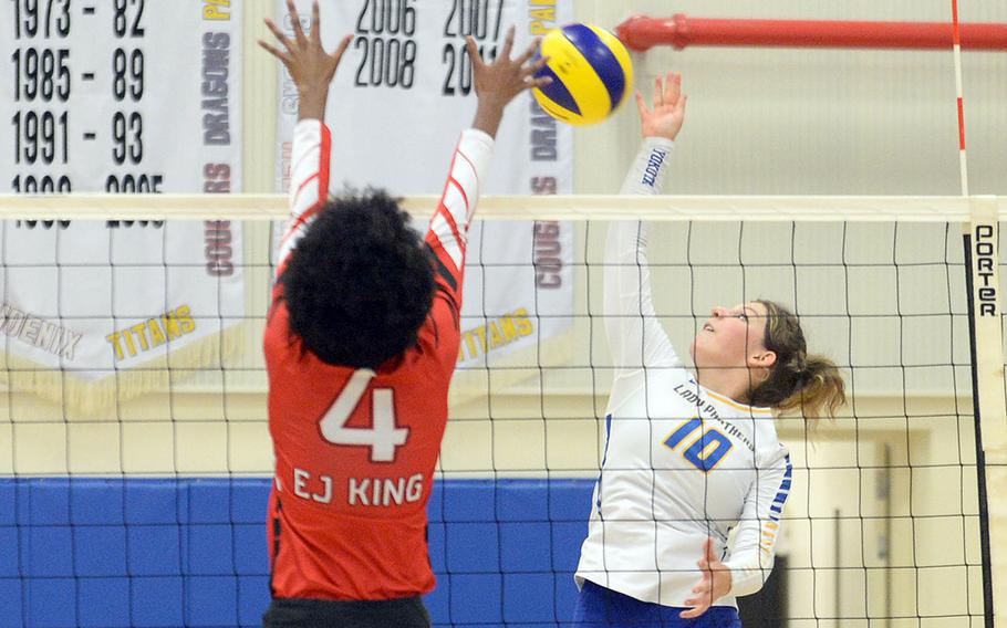 Yokota's Lucy Wellons spikes against E.J. King's Liz Turner during Friday's DODEA-Japan volleyball match. The Cobras won in straight sets.