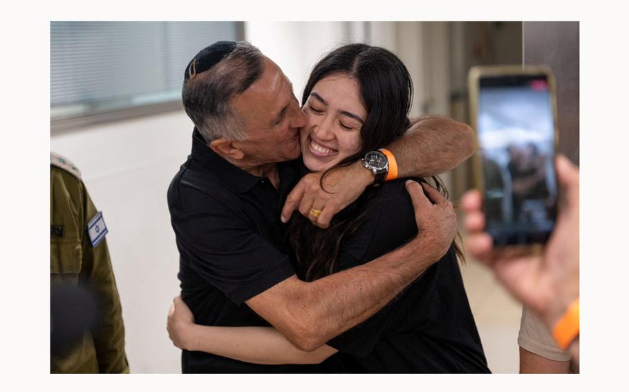 Noa Argamani, a rescued hostage embraces her father, Yakov Argamani, after the military said that Israeli forces have rescued four hostages alive from the central Gaza Strip, in Ramat Gan, Israel, in this handout image obtained by Reuters on June 8, 2024. 