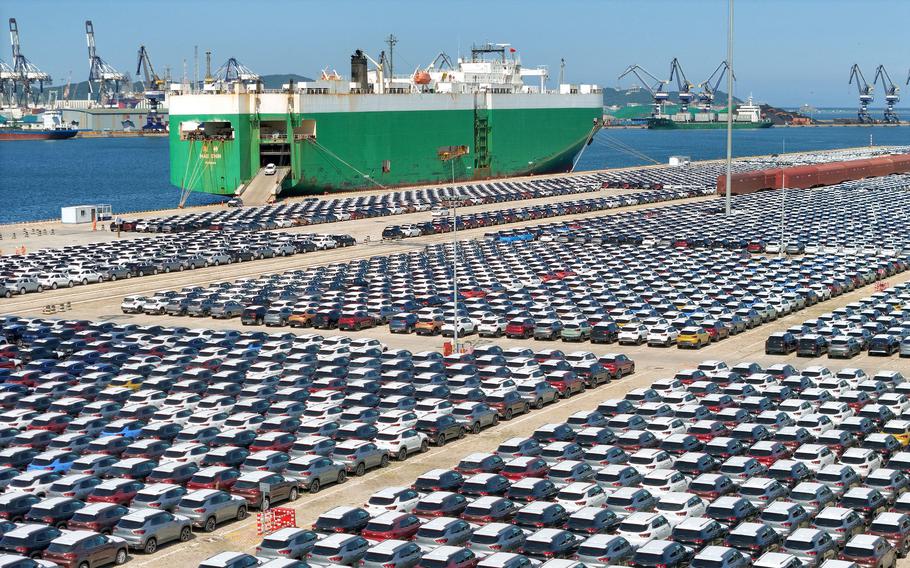 In this photo cars wait to be loaded on to a ship at the port in Yantai, in China's eastern Shandong province on Aug. 23, 2023.