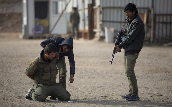 Syrian students at Asayish training academy demonstrate a suspect search during an exercise in the al-Hasakah region of Syria on Dec. 22, 2022. The U.S. military recently reported a lack of progress in certain efforts to train security forces in Iraq and Syria to fight the Islamic State.